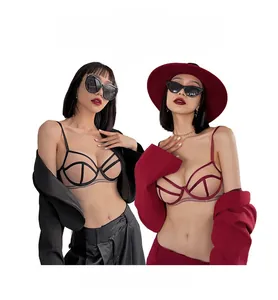 Detail view of contrast mesh patchwork bras in black and burgundy with geometric lines