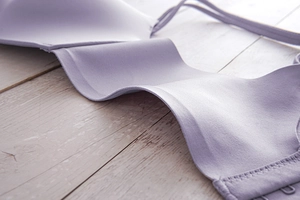 Close-up of seamless light purple bra showing smooth fabric and high-quality stitching details
