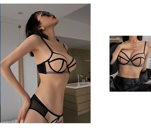 Detail view of skin tone mesh bra and panty set with black piping and geometric design