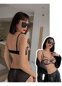 Detail of black lace lingerie set featuring mesh panels and a stylish cut-out design