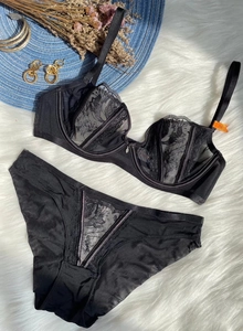 Close-up of black floral lace embroidery on 75B bra and matching panties set
