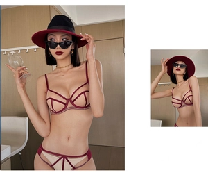 Detailed view of burgundy mesh lingerie set featuring contrast geometric straps and soft cups