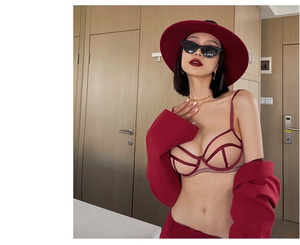 Close-up of a sexy red cutout strappy lingerie set styled with a matching blazer