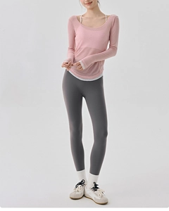 Detail of pink mesh yoga cover-up with breathable fabric for Pilates training sessions