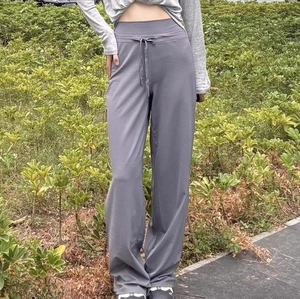 High-waisted grey wide-leg yoga pants with drawstring for pilates and casual wear