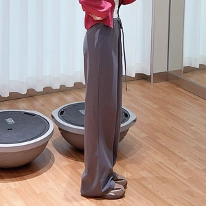 Detail view of high waist loose fitting wide leg yoga pants with adjustable drawstring