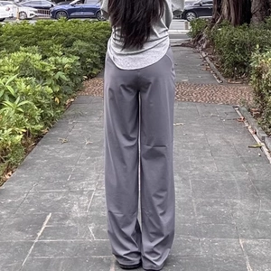 High-waisted dark grey wide-leg yoga pants for women shown in a casual outdoor setting