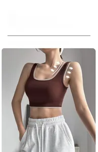 Close-up of wide elastic shoulder straps on high-support color block sports bra