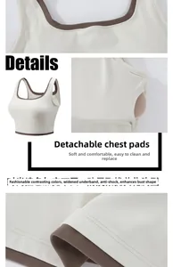 Detail of contrast color sports bra featuring removable pads and wide shockproof hem