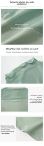 Détail du haut de yoga vert clair avec empiècement en mesh respirant et coutures soignées