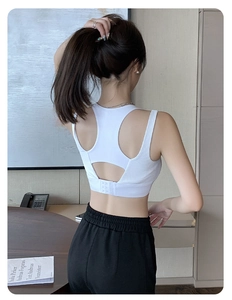 Macro detail of white ribbed sports bra featuring Y-back hollow design and back hook closure