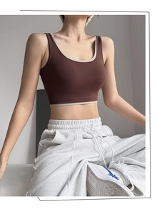 Detail of color-block sports bra with wide straps and high-support elastic fabric