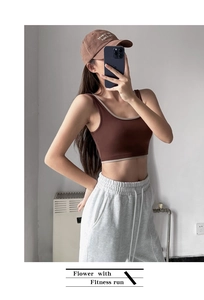 Close-up of brown yoga sports bra with beige contrast trim and high support fabric