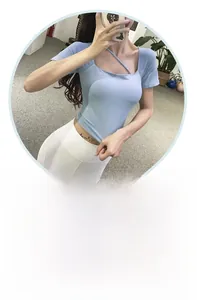 Detailed view of light blue yoga top with square neck and trendy diagonal strap design