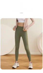 Detail of high-waist grass green yoga pants showing body-sculpting fit and peach lift effect