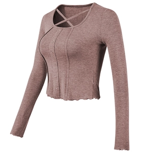Slim-fit ribbed yoga top with cross neckline and button detail in dusty pink