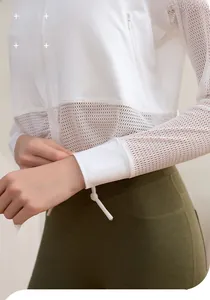 Gros plan sur le tissu en maille respirant et les poignets ajustés d'une veste sport
