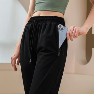 Pantalon de yoga taille haute avec cordon de serrage et poche latérale zippée invisible