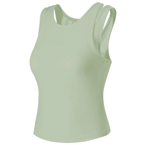 Detail of light green yoga tank top showing hollow double shoulder straps and breathable fabric