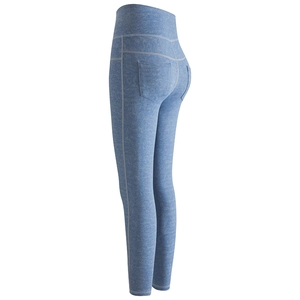 High-waisted peach lift yoga leggings in light blue heather knit with functional pockets