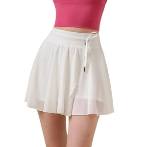 White high-waisted pleated tennis skort with drawstring and inner sports liner