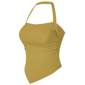Close-up of the mustard yellow halter sports bra with side ruching and irregular hem detail