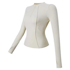 Haut de sport slim fit pour femme en blanc crème avec demi-zip et passe-pouces