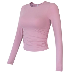 Slim fit pink yoga long sleeve shirt with ruched sides and ribbed elastic fabric texture