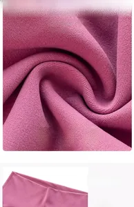 Detail showing soft mauve modal fabric and the high waistband design of yoga flare pants