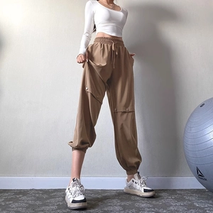 Brown high-waisted cargo joggers with drawstring and button pockets for yoga fitness