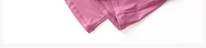 Close-up of rose red yoga pants leg showing durable double-stitched seams and elastic hem
