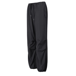 Close-up of black cargo jogger pants featuring drawstring waist and windproof fabric