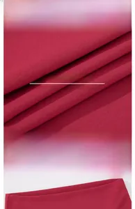 Macro detail of high-waist yoga pants fabric texture and elastic waistband design