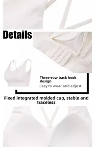 Detail of white yoga bra featuring cross back straps and secure three-row back closure