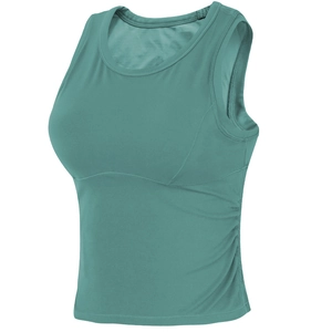 Detailed close-up of teal sports tank top with side ruching and seamless finish