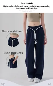 Detailansicht der Sporthose mit hoher Taille, weißen Kordelzügen und seitlichen Taschen