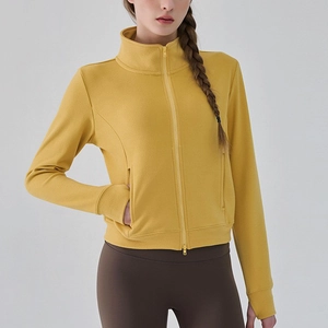 Veste de sport jaune pour femme avec col montant et trous pour les pouces