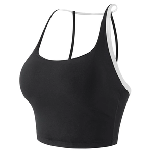 Women's black sports bra with white contrast piping and skinny straps for yoga fitness
