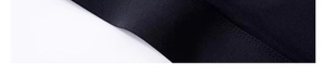 Close-up of double-stitched seams and high-density knit fabric on black sports bra