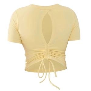 Yellow backless yoga crop top with oval cutout and adjustable drawstring detail