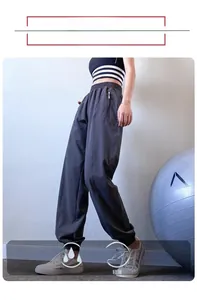 Detail of high waist joggers with hidden zipper pockets in quick-dry fabric