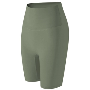 Macro detail of olive green high-waisted yoga shorts with seamless compression waistband