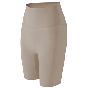 High-waisted compression yoga shorts in khaki nude with wide waistband and sleek fit