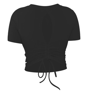 Detail of black yoga top with back teardrop cutout, ruched waist and tie-up design