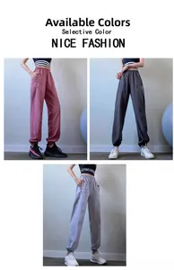 Close-up of high-waist joggers in rose, dark grey, and light grey with zipper pocket