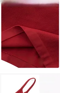 Detail of red ribbed modal yoga vest with soft elastic straps and breathable knit fabric