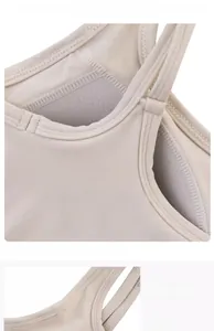 Detail of beige sports bra featuring breathable mesh lining and soft skin-friendly fabric