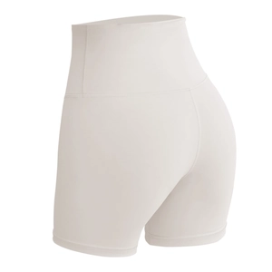 High-waisted beige yoga shorts with tummy control and seamless breathable knit fabric