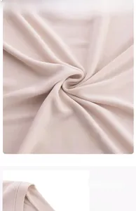 Detail of soft apricot modal fabric yoga top showing crew neck and draped texture