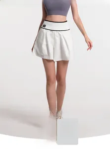 Detail of high waist white 2-in-1 sports shorts featuring a contrast ribbed waistband